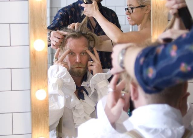Comedian Tony Law being made up for the stage