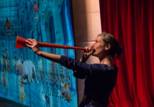 A woman with a red trumpet