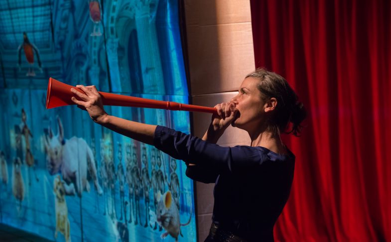 A woman with a red trumpet