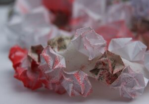 Origami paper with red dusting