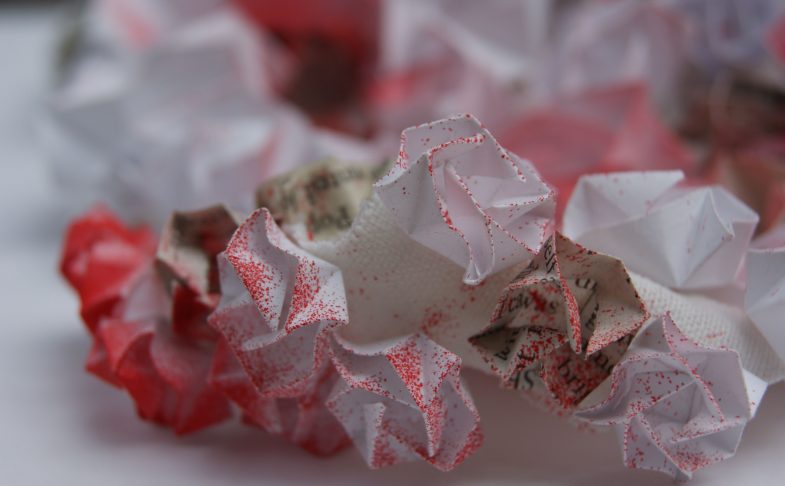 Origami paper with red dusting