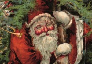Santa carrying a decoration laden tree