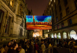 Screen hanging in between buildings