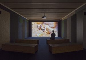 Man watching an art film