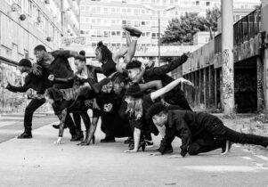 Black and white photo of dancers in a still pose