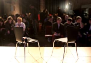 Two chairs on an empty stage