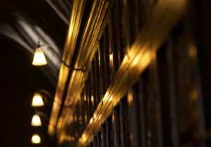 Lights above the bookcases in Chetham's Library