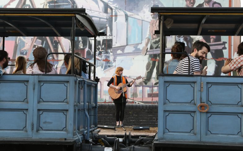 Liz Green performing next to MSI's steam train