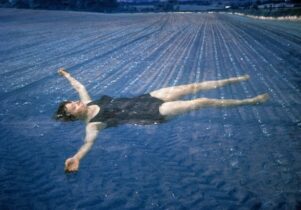 Woman floating in pool