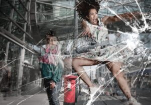 Woman jumping into glass