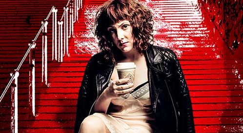 Sophie Willan sitting on stairs