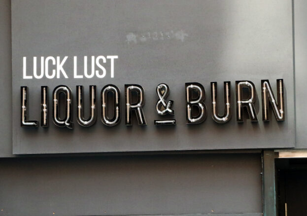 Image of the signage outside of Manchester's Luck Lust Liquor and Burn