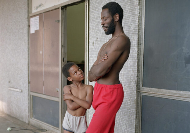 Bill Stephenson, 'Tony the Ton' and Martin age 8, outside the Pop In Centre. Hyde Park Flats, Sheffield, 1988 © Bill Stephenson. Love Among the Ruins: A Romance of the Near Future at S1 Artspace, Sheffield