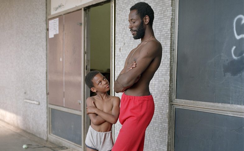 Bill Stephenson, 'Tony the Ton' and Martin age 8, outside the Pop In Centre. Hyde Park Flats, Sheffield, 1988 © Bill Stephenson. Love Among the Ruins: A Romance of the Near Future at S1 Artspace, Sheffield