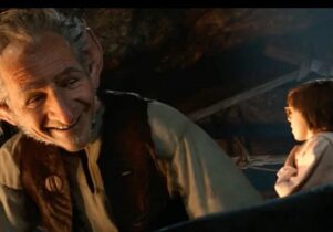 Screen shot from the film of the BFG by Roald Dahl, showing head and shoulders of the BFG looming over Sophie