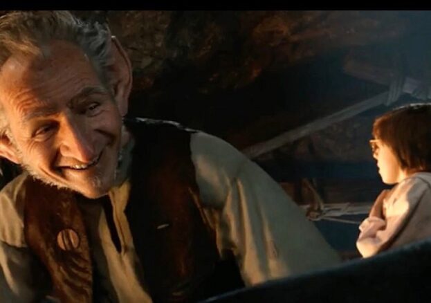 Screen shot from the film of the BFG by Roald Dahl, showing head and shoulders of the BFG looming over Sophie