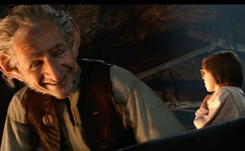 Screen shot from the film of the BFG by Roald Dahl, showing head and shoulders of the BFG looming over Sophie