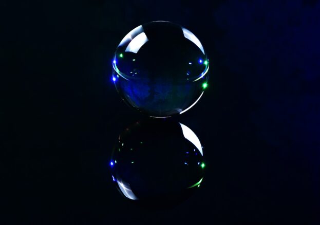 A glass witchball shown against a black background.