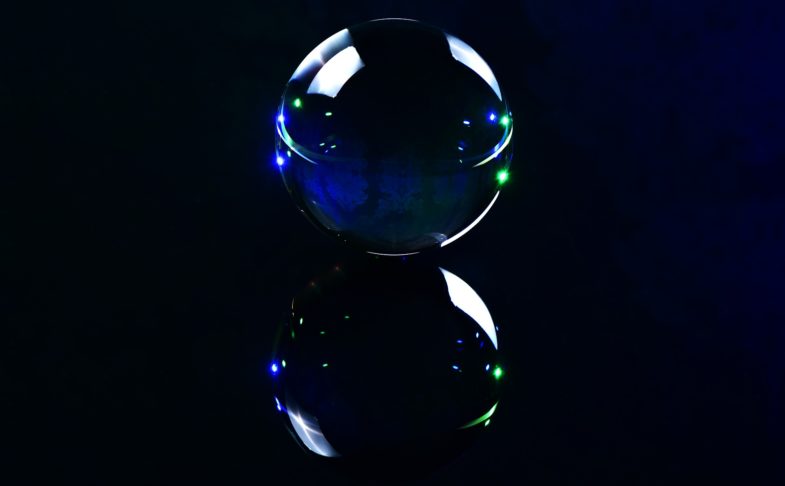 A glass witchball shown against a black background.