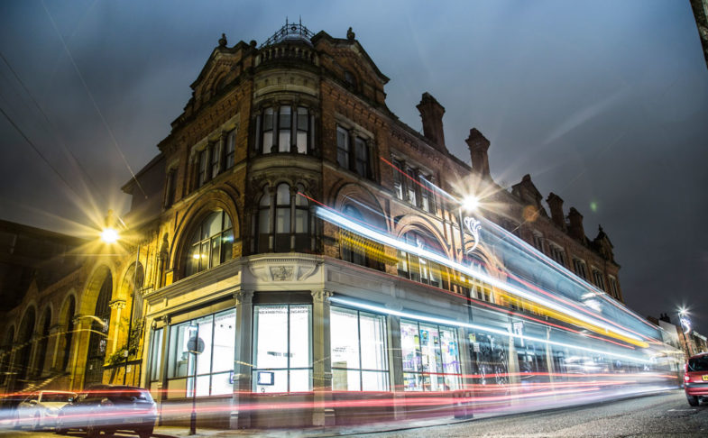 Building shown in evening with colourful blurred lights - for 3D printing architecture workshop