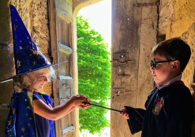 A boy and girl dressed in Halloween costume for the Little school of sorcery at Haddon Hall.