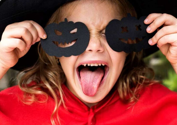 Girl dressed in Halloween costume for CBeebies and CBBC screenings.