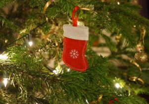 A stocking decoration hung on a tree, to promote Santa crafts