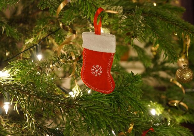 A stocking decoration hung on a tree, to promote Santa crafts