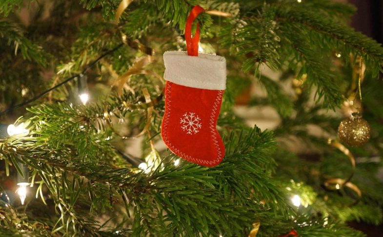 A stocking decoration hung on a tree, to promote Santa crafts