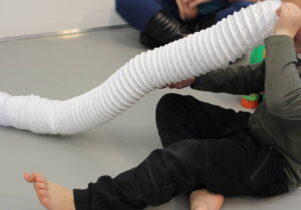 Boy playing with a tube in the SEND friendly sessions