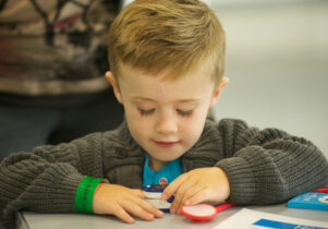 Little boy making something at the space crafts event