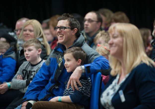 A smiling audience at a meet the expert and science show event