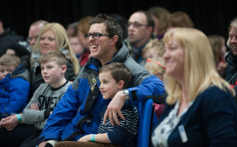 A smiling audience at a meet the expert and science show event