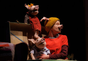 actor with pig puppets The Three Little Pigs at Waterside Arts