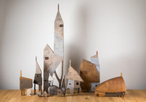 A selection of small carved wooden houses