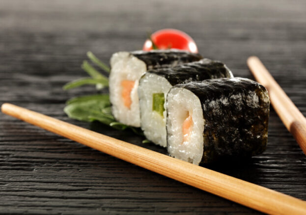 Sushi rolls with chopsticks