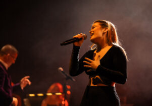 Student singing with microphone