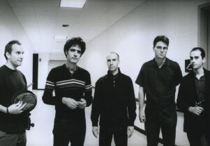 black and white photo of five men