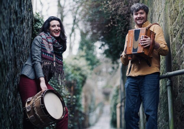 Photo of Delia Stevens and Will Pound outside on cobblestone path