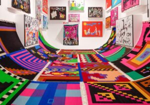a large room filled with colourful artworks of all shapes and sizes