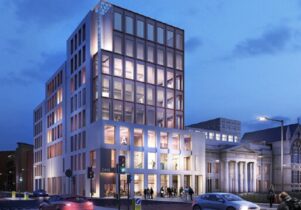 The Grosvenor East building at night, viewed from Oxford Road