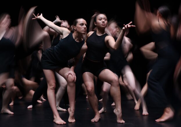 Dancers in black costumes