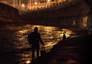 Nychos the street artist following the white rabbit down the Danube in Vienna 