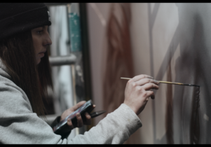 JDL painting a canvas in the studio