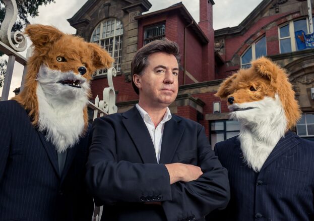David Morley in a suit with two foxes wearing suits!