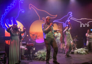 People singing on stage