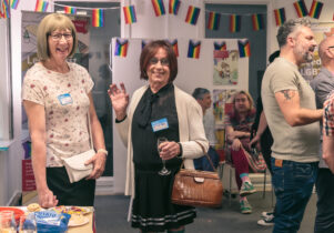 Photo of people socialising at a Pride Place event