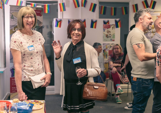 Photo of people socialising at a Pride Place event
