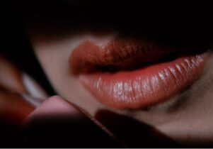 Still from Lost Highway, close up of lips speaking on a phone