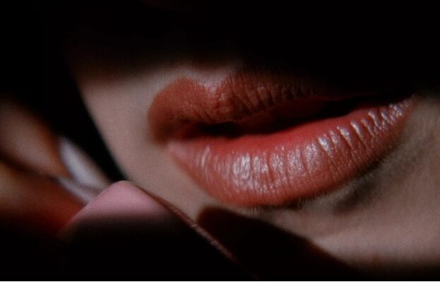Still from Lost Highway, close up of lips speaking on a phone